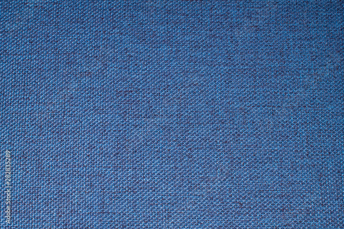 Dark blue background from a textile material linen natural canvas