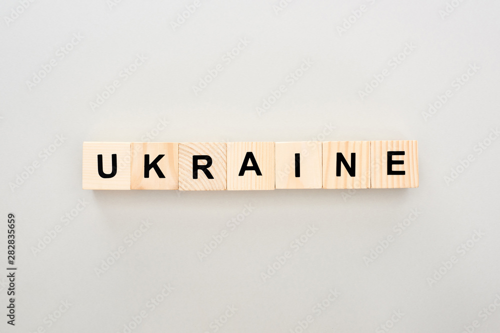 top view of wooden blocks with Ukraine lettering on white background top view of wooden blocks with Ukraine lettering on white background