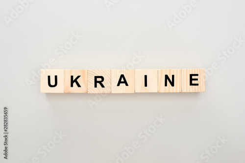 top view of wooden blocks with Ukraine lettering on white background