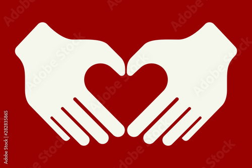Hands forming a heart shape with their fiingers.