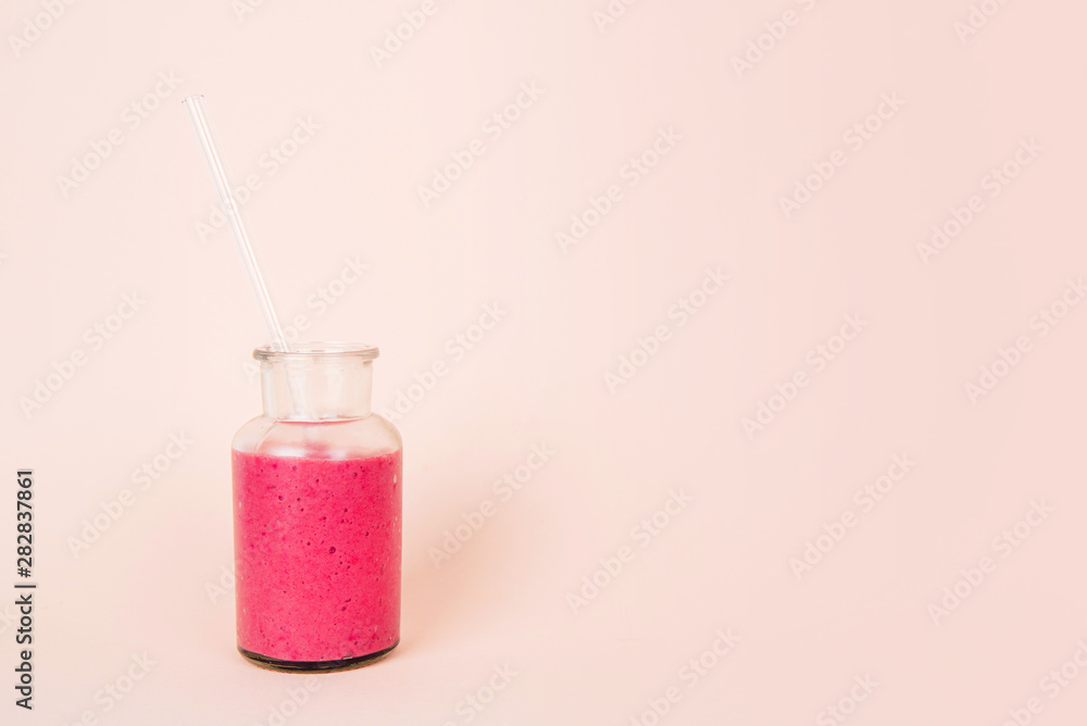 Glass Of Pink Drink With Glass Drinking Straw. Glass Of Pink Drink With Glass Drinking Straw.