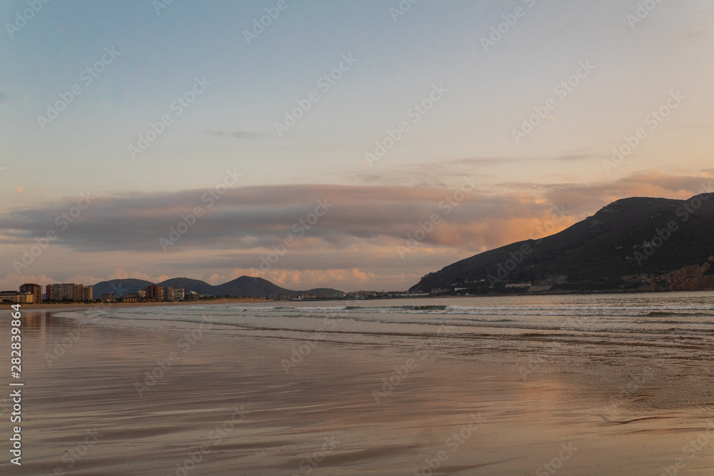 sunrise on the beach of La Salve in Laredo, Cantabria