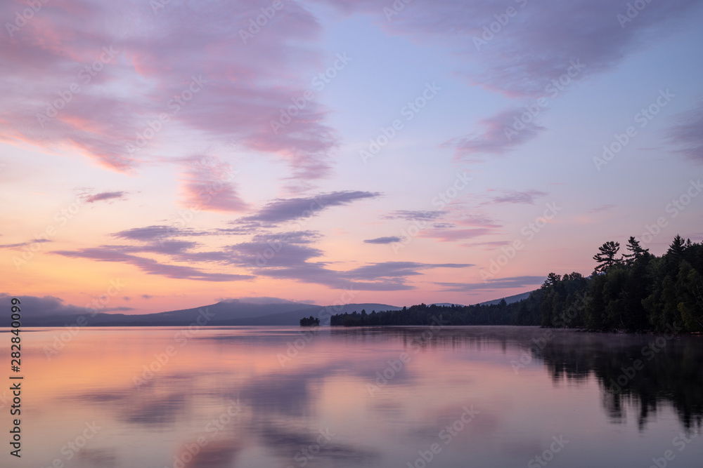 Pink and purple sunrise over Flagstaff Lake in the High Peaks region of western Maine.