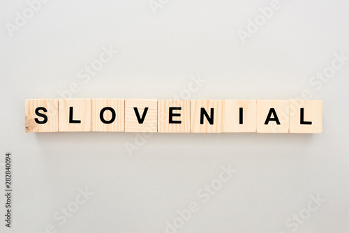 top view of wooden blocks with lettering on white background