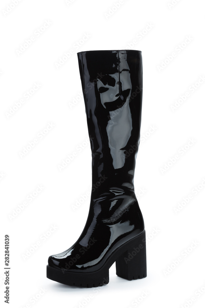 Woman high knee leather boots isolated on white background Woman high knee leather boots isolated on white background
