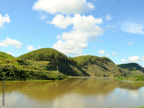 lake in the mountains and clouds in sunny day.