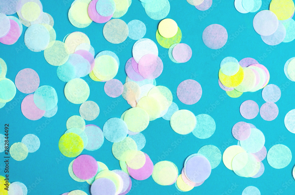 Turquoise background with many round multicolored confetti. Turquoise background with many round multicolored confetti.