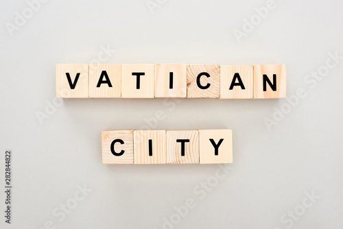 top view of wooden blocks with Vatican City lettering on white background