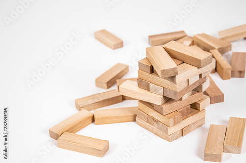 wood blocks tower game. planning  strategy and risk for business and finance. isolated background