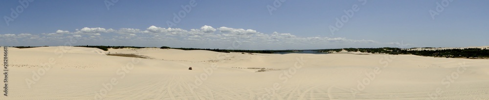 Panoramic view dunes and small car in Fortaleza City, Ceará, Brazil