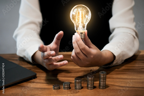 saving coins idea with light bulb for investment Concept idea and innovation.