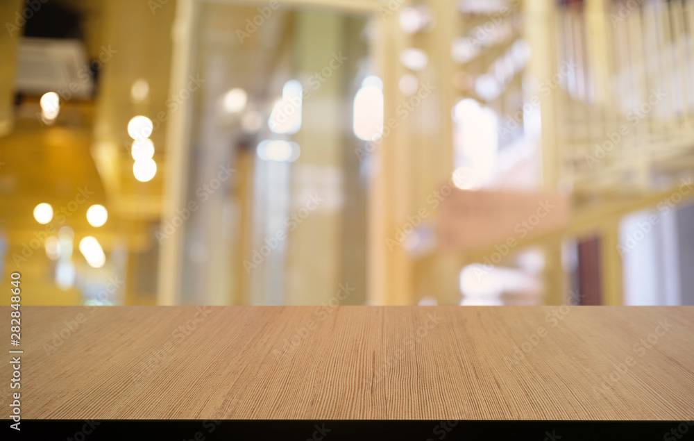 Empty dark wooden table in front of abstract blurred bokeh background of restaurant . can be used for display or montage your products.Mock up for space. Empty dark wooden table in front of abstract blurred bokeh background of restaurant . can be used for display or montage your products.Mock up for space.