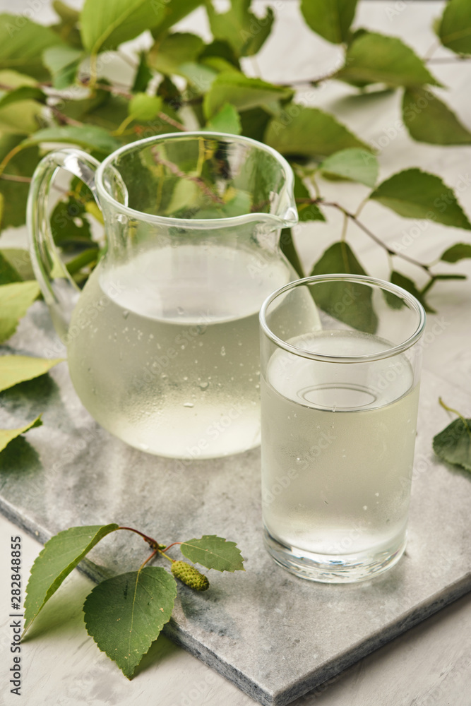 Birch juice. Traditional birch sap. A refreshing traditional Russian spring drink Birch juice. Traditional birch sap. A refreshing traditional Russian spring drink