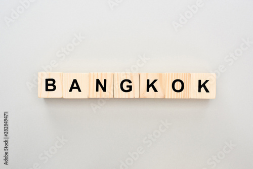 top view of wooden blocks with Bangkok lettering on grey background