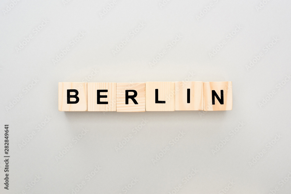 top view of wooden blocks with Berlin lettering on grey background top view of wooden blocks with Berlin lettering on grey background