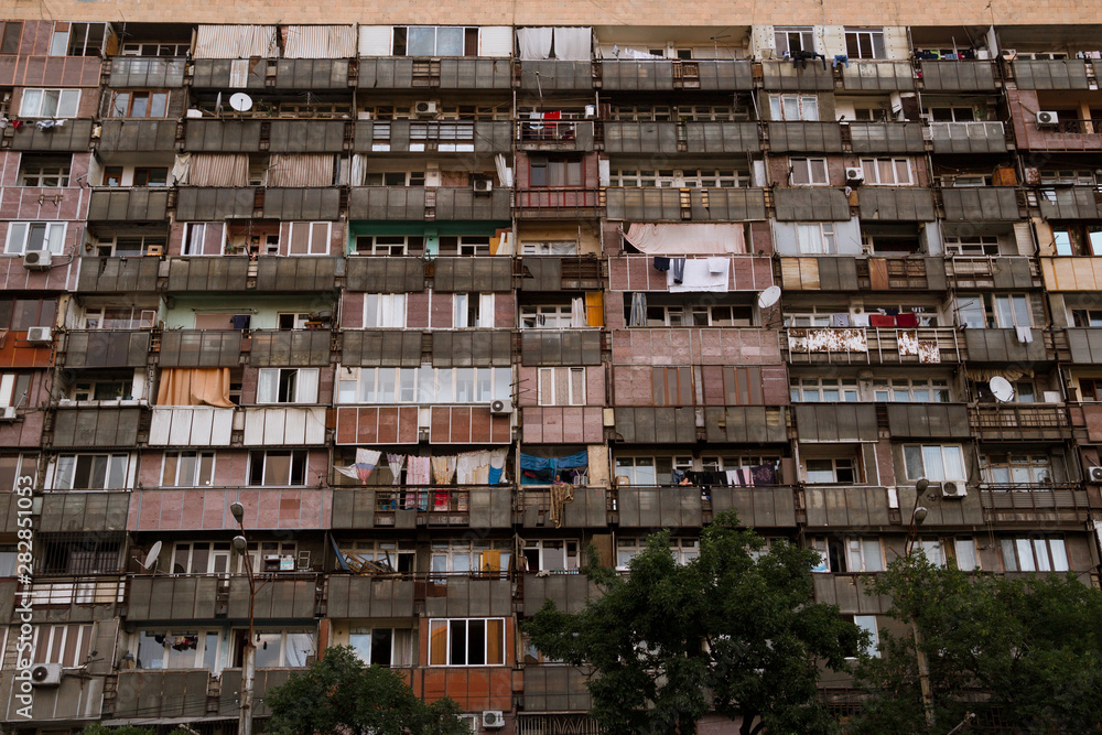 View of the old high-rise building. Balconies and windows. View of the old high-rise building. Balconies and windows.