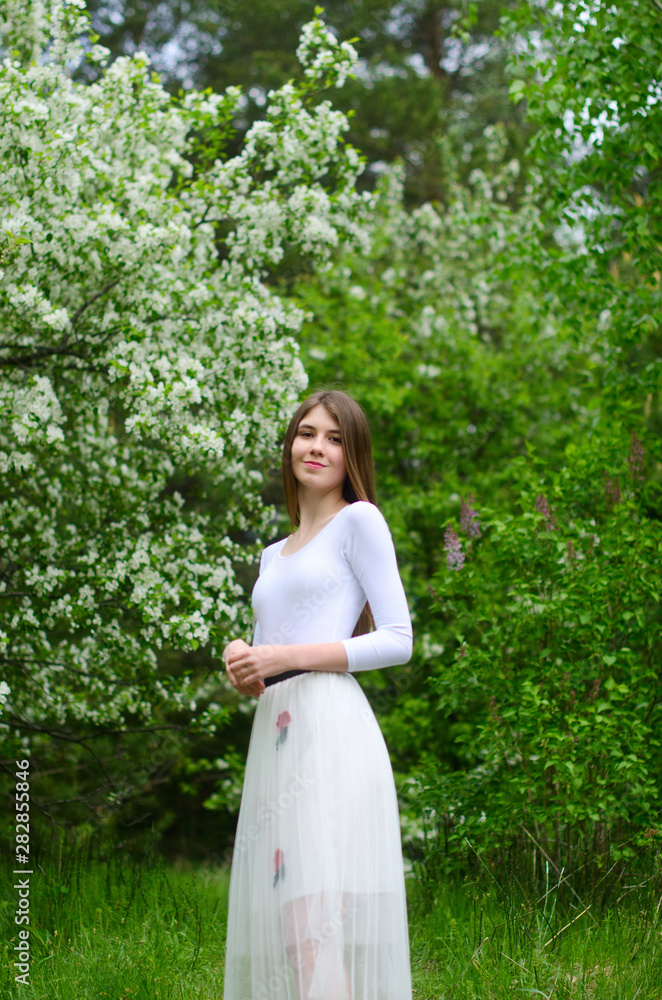 beautiful girl in a blooming Park