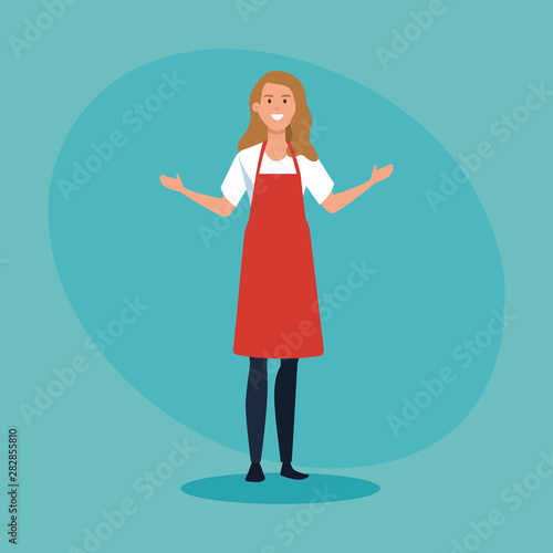 happy saleswoman with casual clothes wearing apron