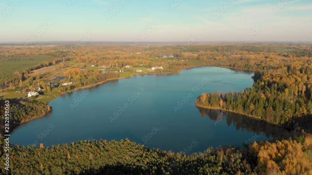 Bird's-eye view of autumn forest and a small lake