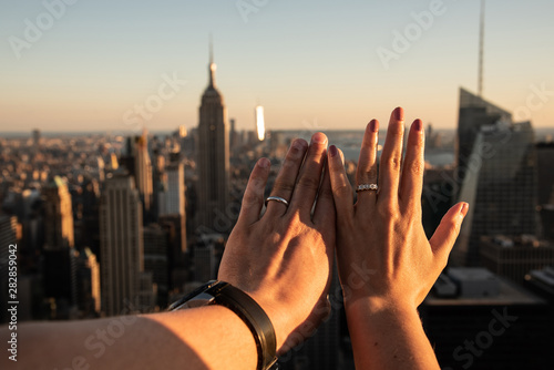 Hands with weeding rings with the Empire State in the background