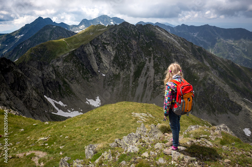 little girl hiker on a path