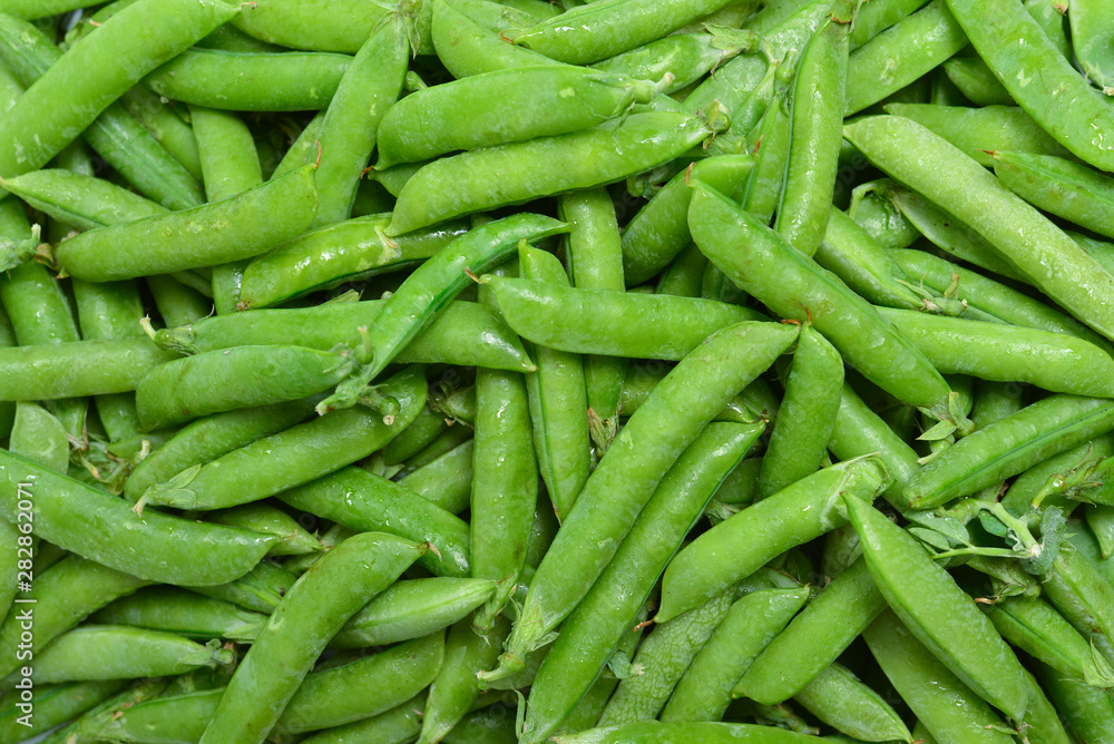 Fresh pea pods as background. Top view. Fresh pea pods as background. Top view.