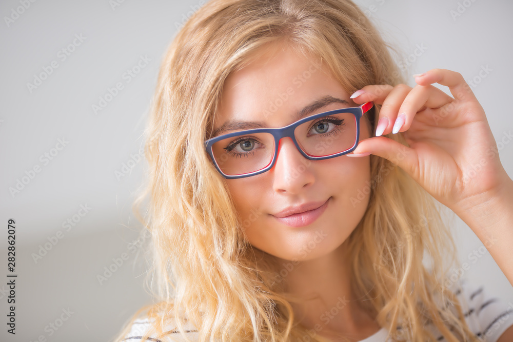 Portrait of blonde young woman in glasses Portrait of blonde young woman in glasses