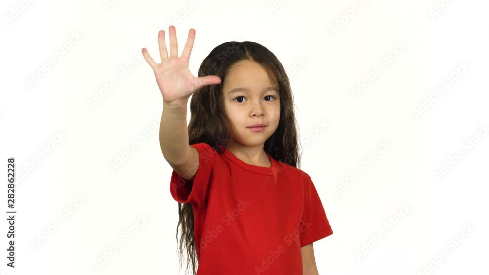 Portrait little child counting fingers her hands on white background Portrait little child counting fingers her hands on white background