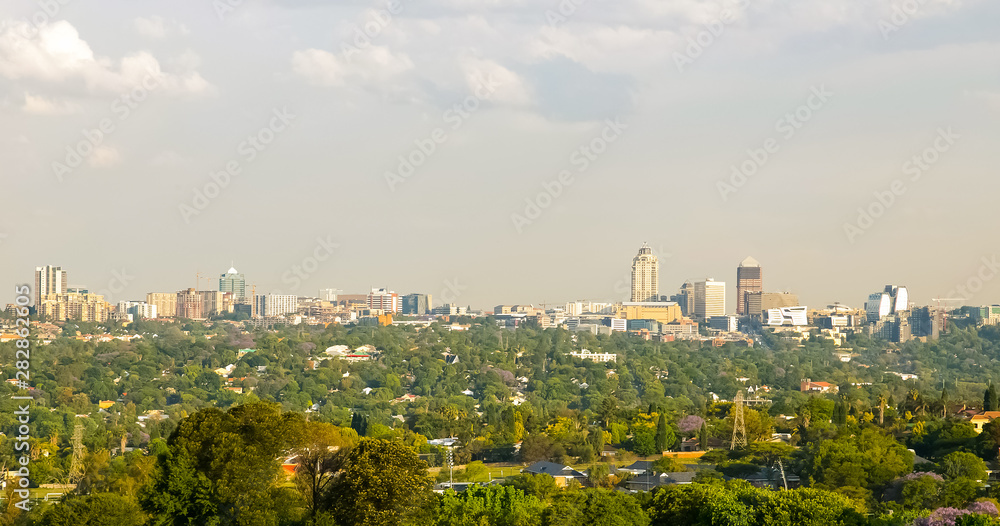 Fototapeta premium Skyline of buildings and residential suburban neighborhood in Sandton CBD Johannesburg
