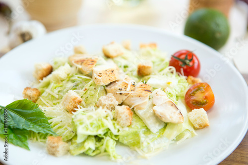 Homemade Vegetable salad with chicken and cheese on table Healthy and tasty food.