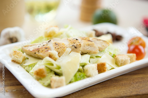 Homemade Vegetable salad with chicken and cheese on table Healthy and tasty food.