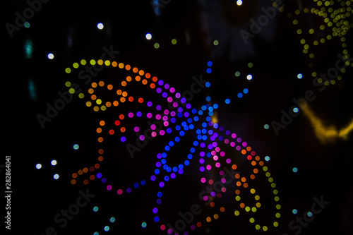 A butterfly formed by LED lights and the Bokeh effect in various colors. © Jason Yoder