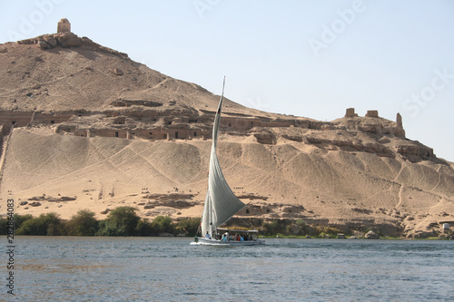 sailing the nile on a felucca, traditional sailboat in egypt