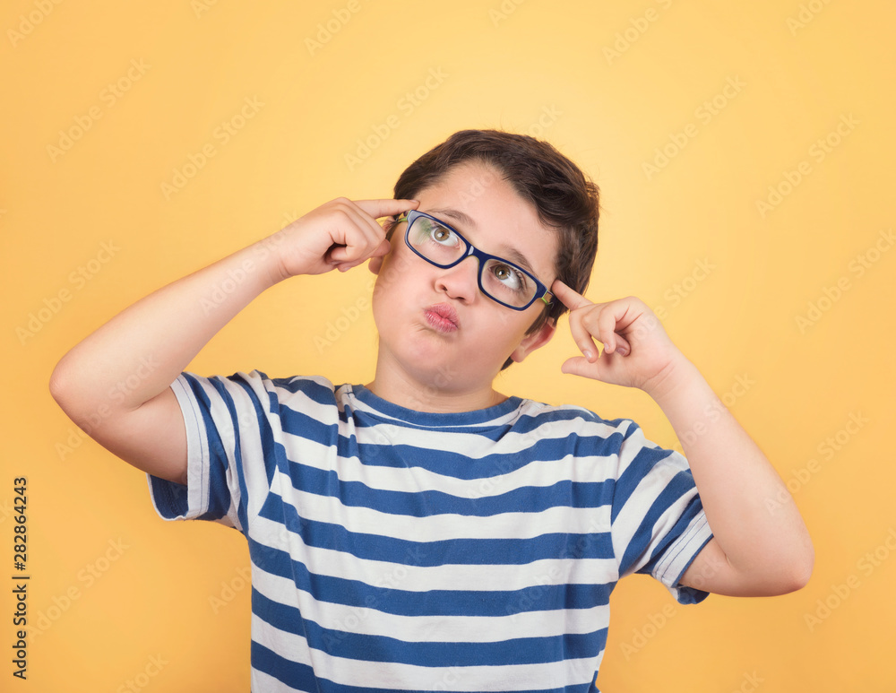 Portrait of thoughtful child with eyeglasses Portrait of thoughtful child with eyeglasses