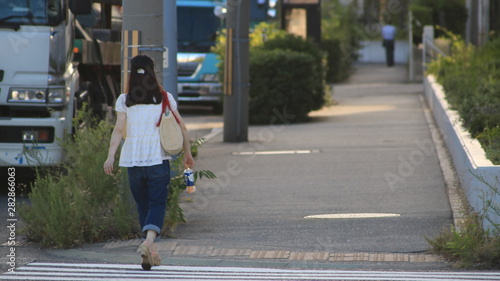 young woman walking on the street
