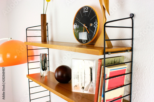 wooden book shelf hanging on the wall made out of teak danish design mid century close up front view side top HIGH RESOLUTION wood 50s 60s minimalistic modern isolated on white background photo