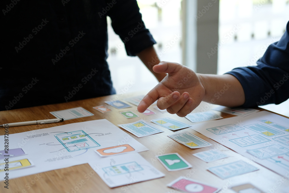 user experience UX designer designing web on smart phone layout. UI developer planning working on mobile application prototype user experience UX designer designing web on smart phone layout. UI developer planning working on mobile application prototype