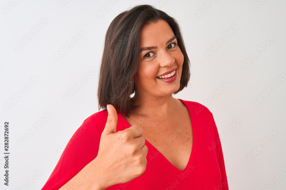 Young beautiful woman wearing red t-shirt standing over isolated white background happy with big smile doing ok sign, thumb up with fingers, excellent sign Young beautiful woman wearing red t-shirt standing over isolated white background happy with big smile doing ok sign, thumb up with fingers, excellent sign