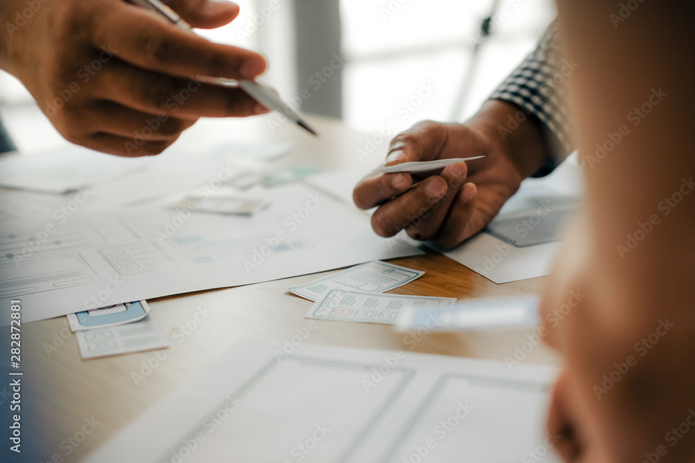 user experience UX designer designing web on smart phone layout. UI developer planning working on mobile application prototype user experience UX designer designing web on smart phone layout. UI developer planning working on mobile application prototype