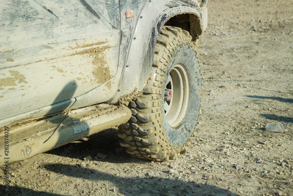 Off-road dirty car wheels. Swamp rubber. Jeep in the swamp. Trial competition. Off-road dirty car wheels. Swamp rubber. Jeep in the swamp. Trial competition.
