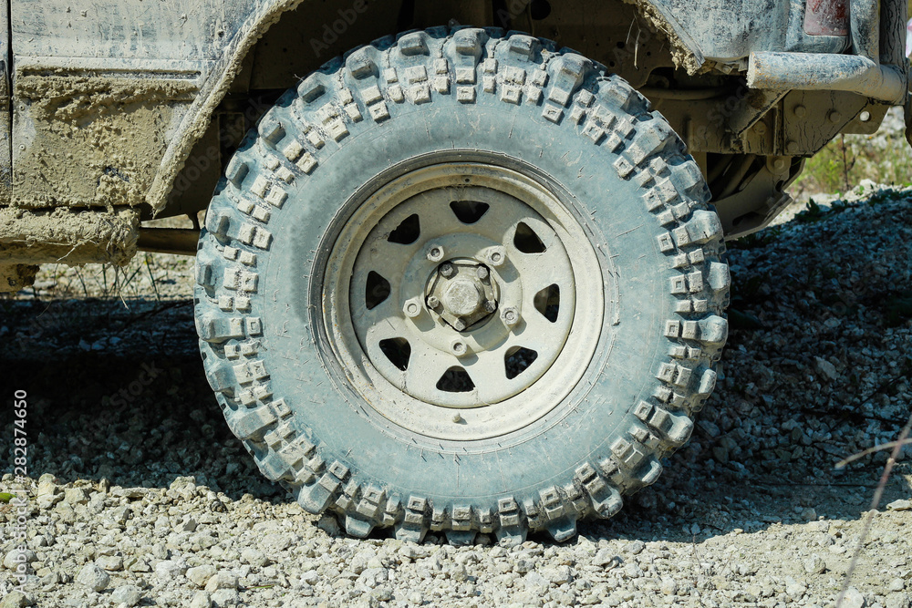 Off-road dirty car wheels. Swamp rubber. Jeep in the swamp. Trial competition.