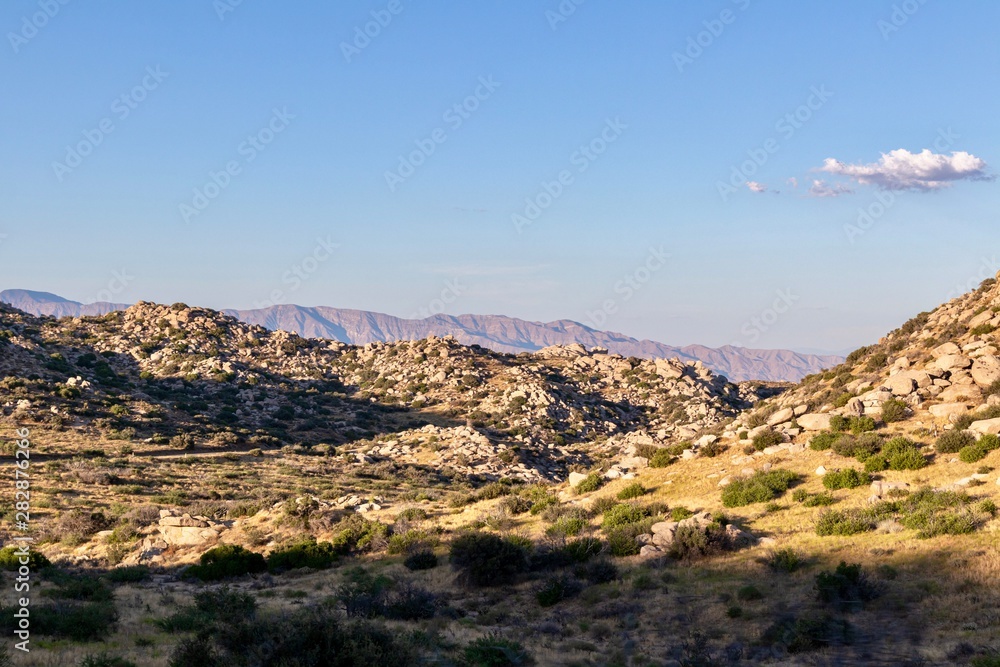 Rocky desert landscape with mountains