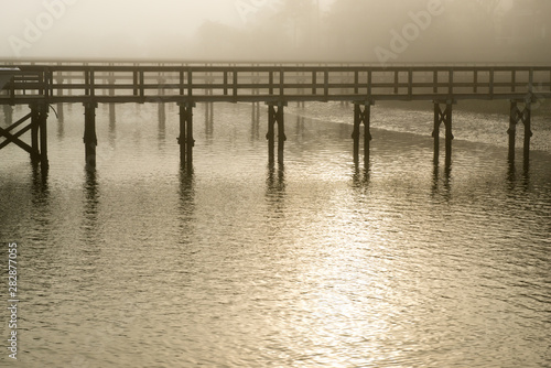 Beautiful tinted foggy picture of a private dock along the Kiawah River in South Carolina. © jadimages