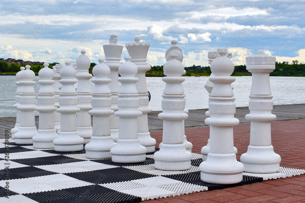 big street chessmen on beach. Chess outdoors
