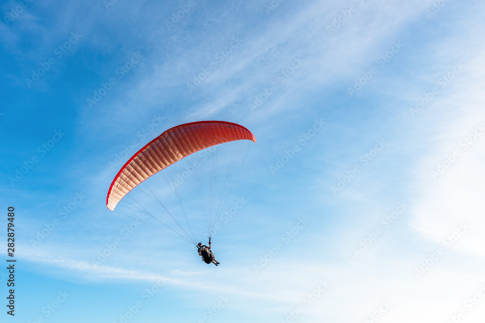 Paragliding Extreme sport, Paraglider flying on the blue sky and white cloud in Summer day at Phuket Sea, Thailand. Paragliding Extreme sport, Paraglider flying on the blue sky and white cloud in Summer day at Phuket Sea, Thailand.