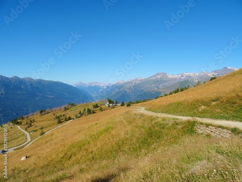 Nature, meadows and peaks that characterize the landscape of the Italian Alps in Val di Susa, near the town of "Susa", Piedmont - August 2019.
