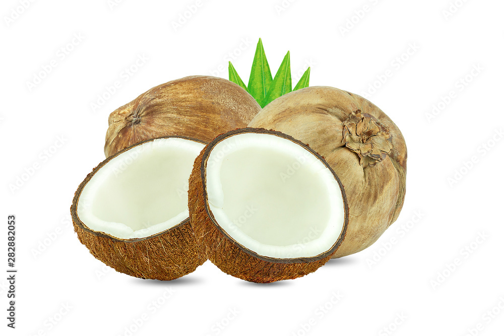Coconuts and green palm tree leaf isolated on a white background.Healthy Food, skin care concept. Coconuts and green palm tree leaf isolated on a white background.Healthy Food, skin care concept.