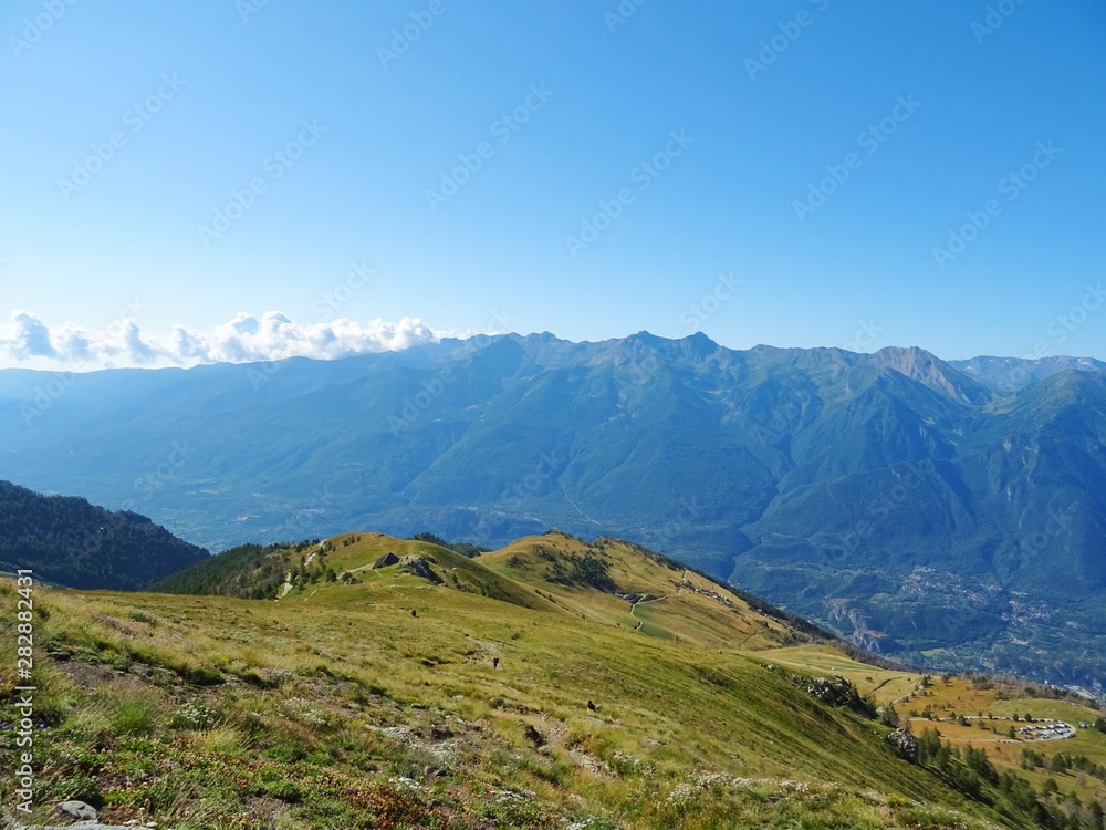 Obraz premium Nature, meadows and peaks that characterize the landscape of the Italian Alps in Val di Susa, near the town of 