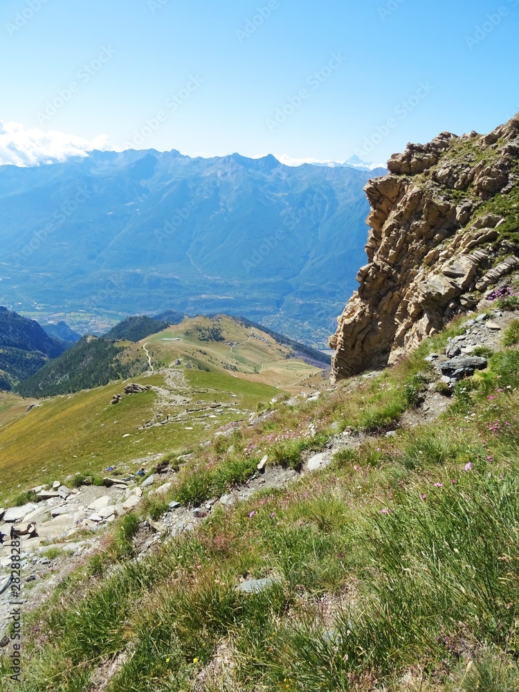 Obraz premium Nature, meadows and peaks that characterize the landscape of the Italian Alps in Val di Susa, near the town of 