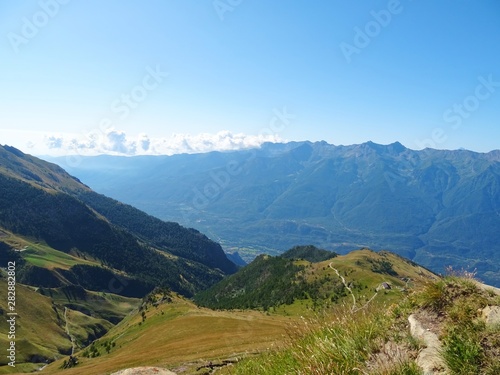 Nature, meadows and peaks that characterize the landscape of the Italian Alps in Val di Susa, near the town of "Susa", Piedmont - August 2019.